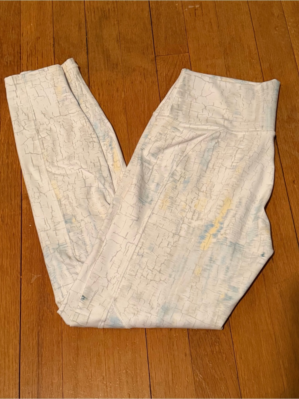 Fabletics White Crackle-Print Leggings with Pale Blue and Yellow Accents